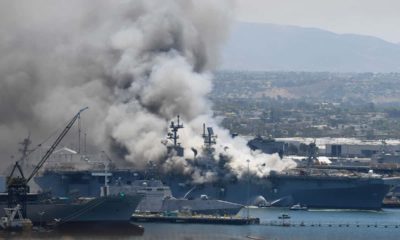 Photo of smoke rising from the USS Bonhomme Richard at Naval Base San Diego